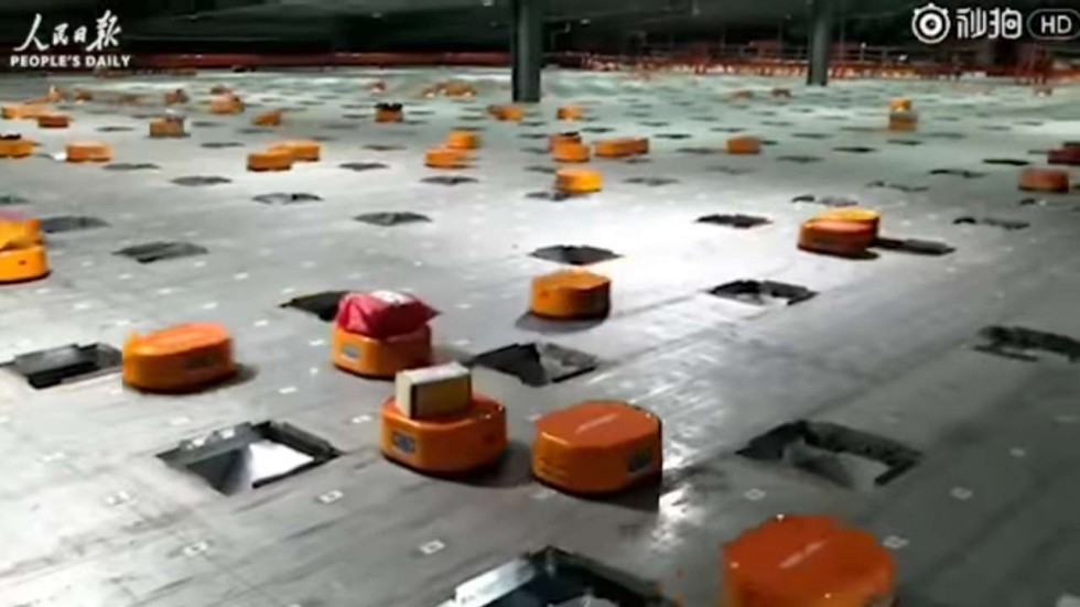 Chinese firm halves Worker Costs by hiring Army of Robots to sort out 200,000 packages a Day